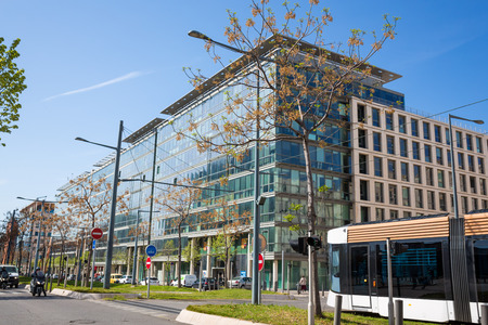 Modern business center in the city with tramの写真素材