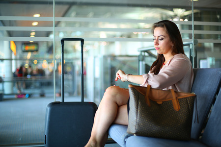 Young business woman at airportの写真素材