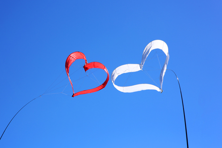 Heart shaped kite on blue sky / Valentine's day conceptの写真素材