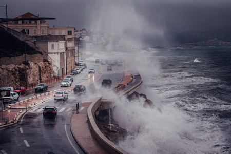 Stormy background with Big Waves Splash Against Cityのeditorial素材