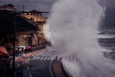 Stormy background with Big Waves Splash Against Cityのeditorial素材
