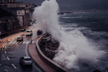 Stormy background with Big Waves Splash Against Cityのeditorial素材