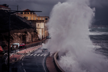 Stormy background with Big Waves Splash Against Cityのeditorial素材