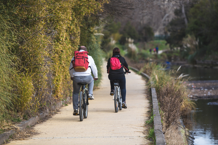 Couple makes bike in the parkの写真素材