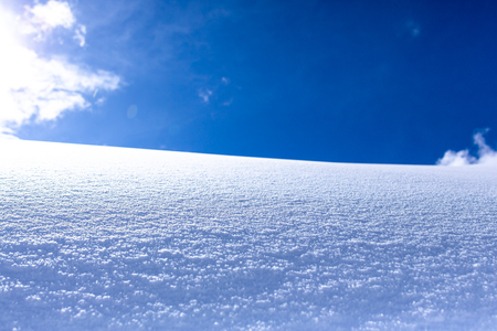 Winter holidays with snowy hill backgroundの写真素材