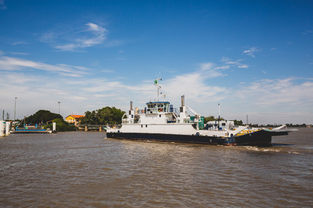 Ferry Boat carrying vehicles and tourists crosses the Rhone in Franceの写真素材