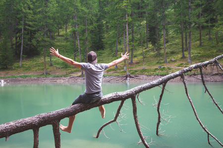 man celebrating nature on a lakeの写真素材