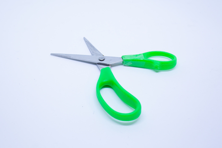Green Open Scissors isolated on a white backgroundの写真素材