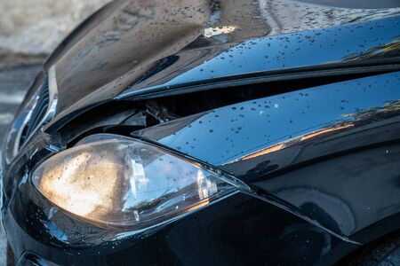 Car crash, frontal collision damage with distorted bodyworkの写真素材