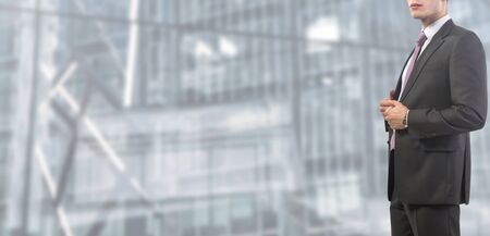 relaxed businessman standing at workの写真素材