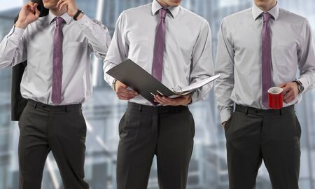 businessmen standing with different actionsの写真素材