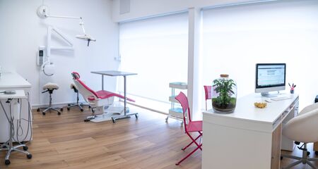 dental office interior with dentist chair and medical equipmentの写真素材