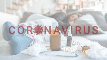 woman infected with coronavirus is lying on her sofaの写真素材