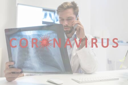 Coronavirus 2019-nCoV. Doctor analyzing X-ray of patient. Epidemic virus Respiratory Syndrome. Corona virus outbreaking.の写真素材