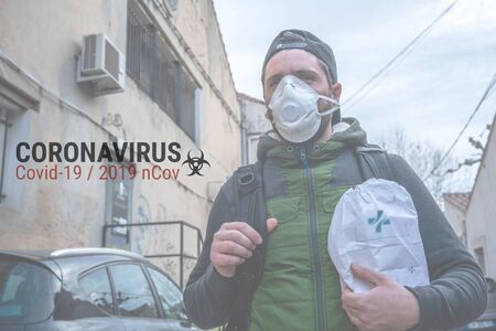 Man with protective medical mask FFP2 against virus Covid-19 or coronavirusの写真素材