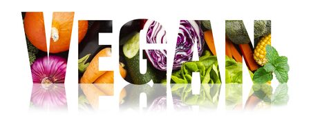 Vegan, healthy vegetarian eating with fresh vegetables concept. VEGAN title with vegetables inlay isolated on white backgroundの写真素材