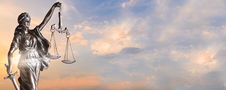 Lady Justice. Statue of Justice on sky background. Justice banner concept with copy spaceの写真素材