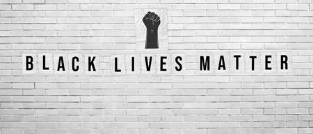 Black Lives Matter. Illustration with words written on paper posters on white brick wall background....