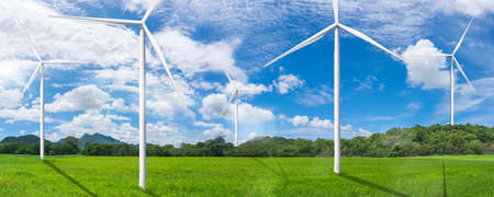 Wind turbine field in meadow, sunny day - Renewable Energy concept, web banner