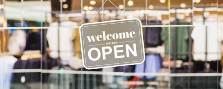 Open shop with with message text on window Welcome we're open - Banner design