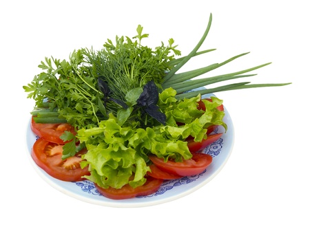 Sliced ââvegetables on a plate. Tomatoes, onions, parsleの写真素材