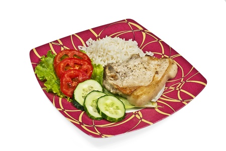 meat with vegetables and rice on red  plateの写真素材