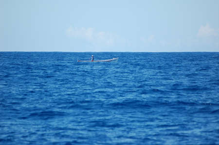 fisherman boat in the blue sea off the coast of mauritius