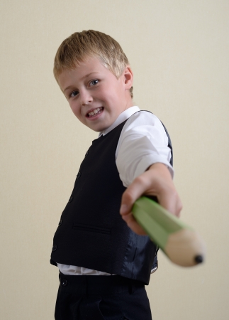 brave schoolboy with big pencilの写真素材