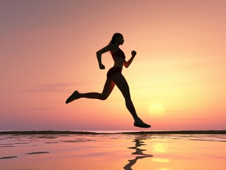 Woman running on the beachの写真素材