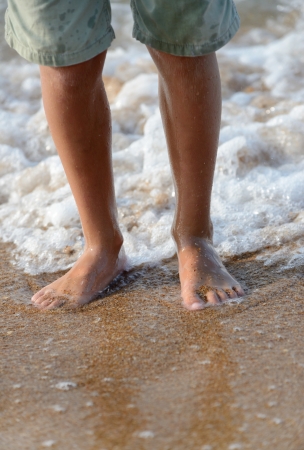 feet on the sea beachの写真素材