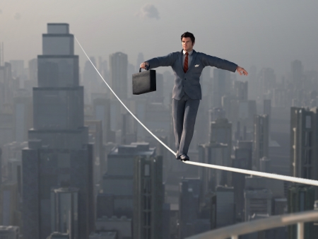Businessman walking on Tightropeの写真素材