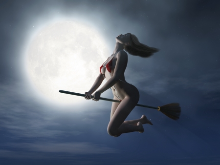 witch flying on broom at halloween night の写真素材