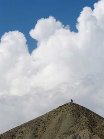 travelers on a mountain topの写真素材