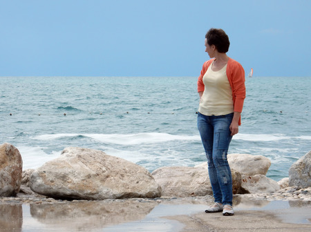 woman looks at seaの写真素材