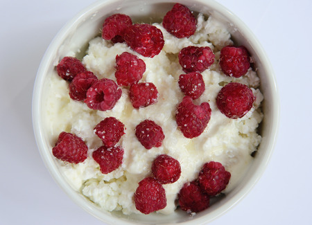 cup with cream cheese and raspberriesの写真素材