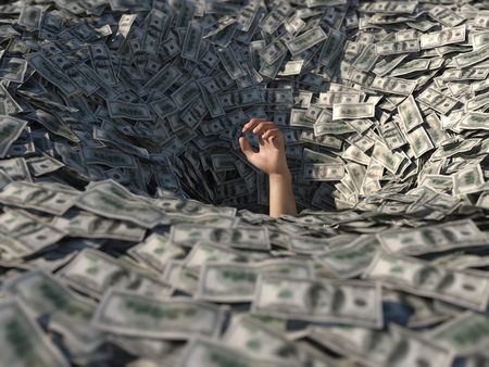 hand drowning in moneyの写真素材