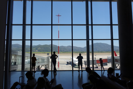 Passengers awaiting departure at the airportの写真素材