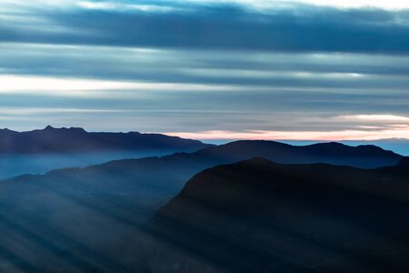 Milky cloud on sky  at sunrice time from highest mountainの写真素材