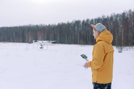 Young male tourist Using drone photographs and shoots natureの写真素材