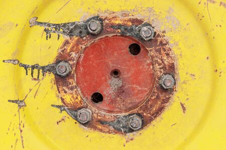 An agricultural machinery tire with on an yellow and red wheelの写真素材