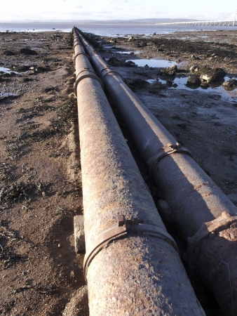 Severn beach on the estuary, pipe going into sea, Gloucestershire, January 2011