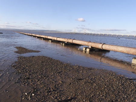 Severn beach on the estuary, pipe going into sea, Gloucestershire, January 2011