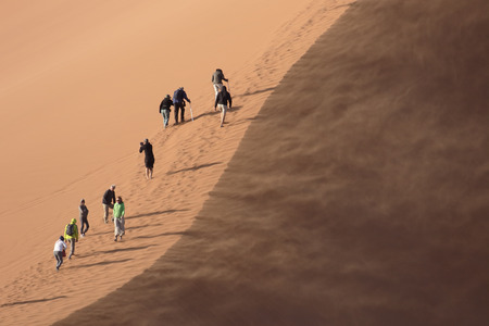 People climbing sand dunes, Sossusvlei Namib-Naukluft, Namibia,  August 2016のeditorial素材