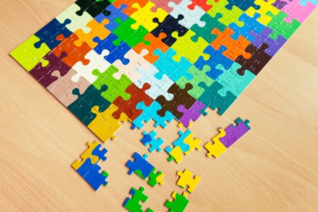Puzzle with a pattern of colorful puzzle pieces