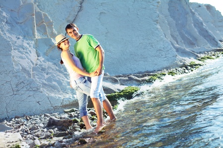 Young couple spending a nice sunny morning on the beachの写真素材