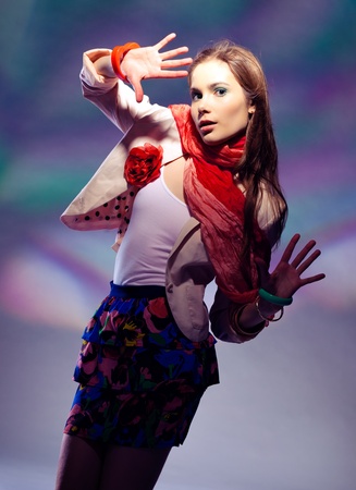 Beautiful girl posing on colorful backgroundの写真素材