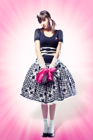 Beautiful girl in cosplay suit on pink backgroundの写真素材