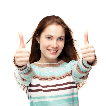 Young beautiful girl giving two thumbs up, isolated on whiteの写真素材