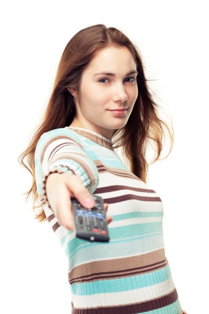Young beautiful girl with remote control, isolated on whiteの写真素材