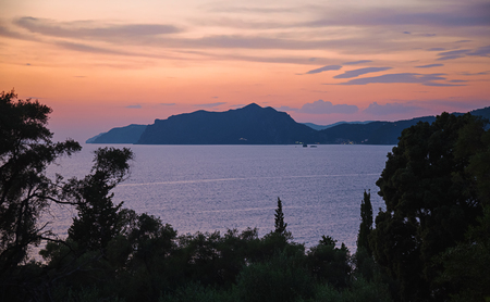 Dramatic coastal sunset on Corfu island, Greeceの写真素材